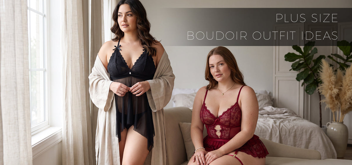 Two plus-size women modeling black and burgundy lace lingerie in a softly lit bedroom for a boudoir photoshoot