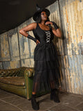Plus size woman wearing a black Halloween witch costume dress set with tiered mesh skirt and witch hat