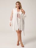 Plus size woman wearing 2 piece white satin robe set with butterfly embroidered mesh sleeves and lace chemise