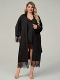 Plus size woman wearing 2 piece black satin robe and lace trimmed chemise dress set
