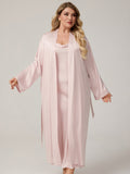 Plus size woman wearing 2 piece black satin cowl neck nightdress and long kimono robe set